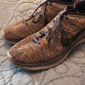 Red, blue, green, grey, black speckled fly knits